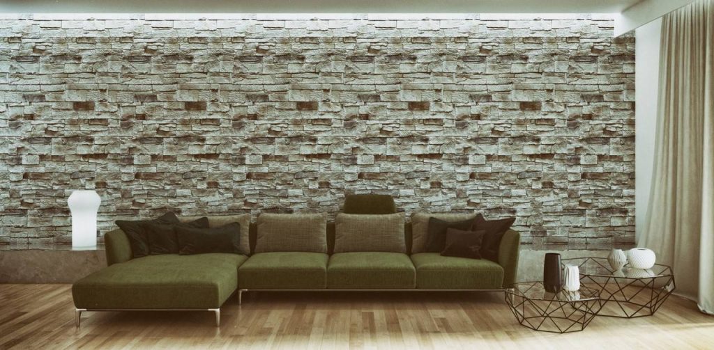 Sala de estar com sofá e parede com pedras naturais ao fundo